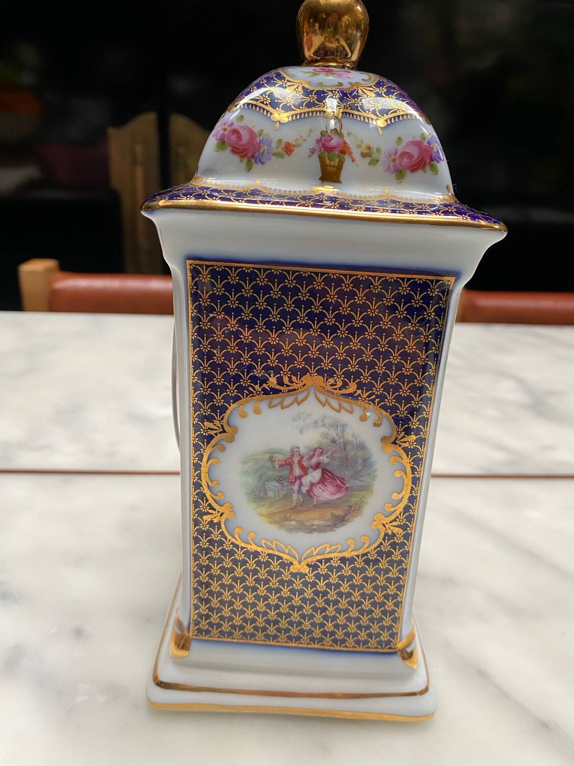 English porcelain clock and candle holders