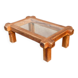 Coffee table with a glass top in Scandinavian brutalist style made of pine.