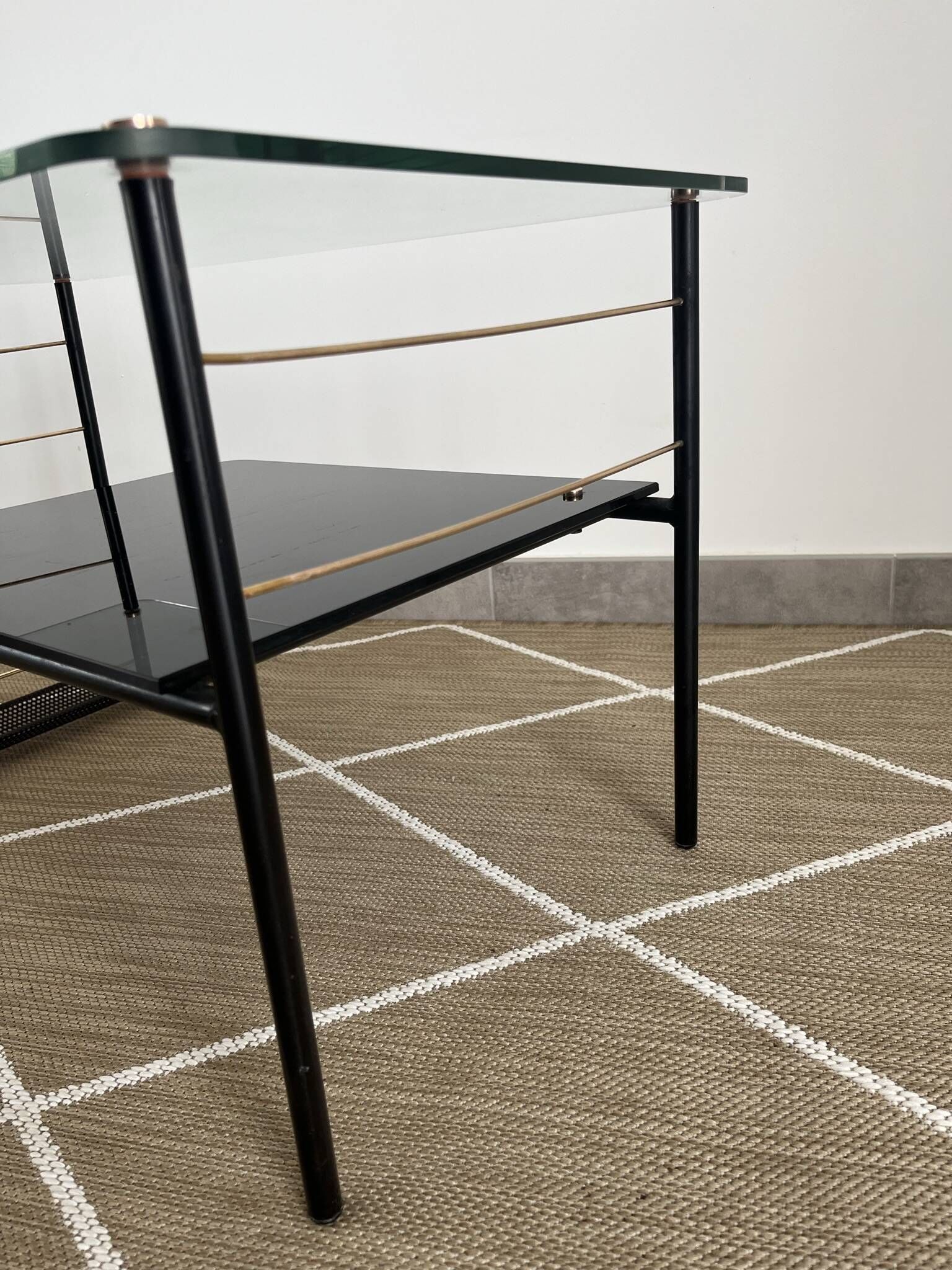 Metal and glass coffee table with magazine rack by Roche Bobois from the 1950s.