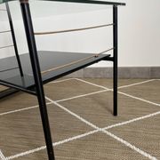 Metal and glass coffee table with magazine rack by Roche Bobois from the 1950s.