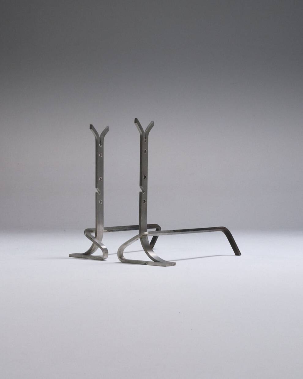 Pair of modernist brushed steel andirons, 1970s