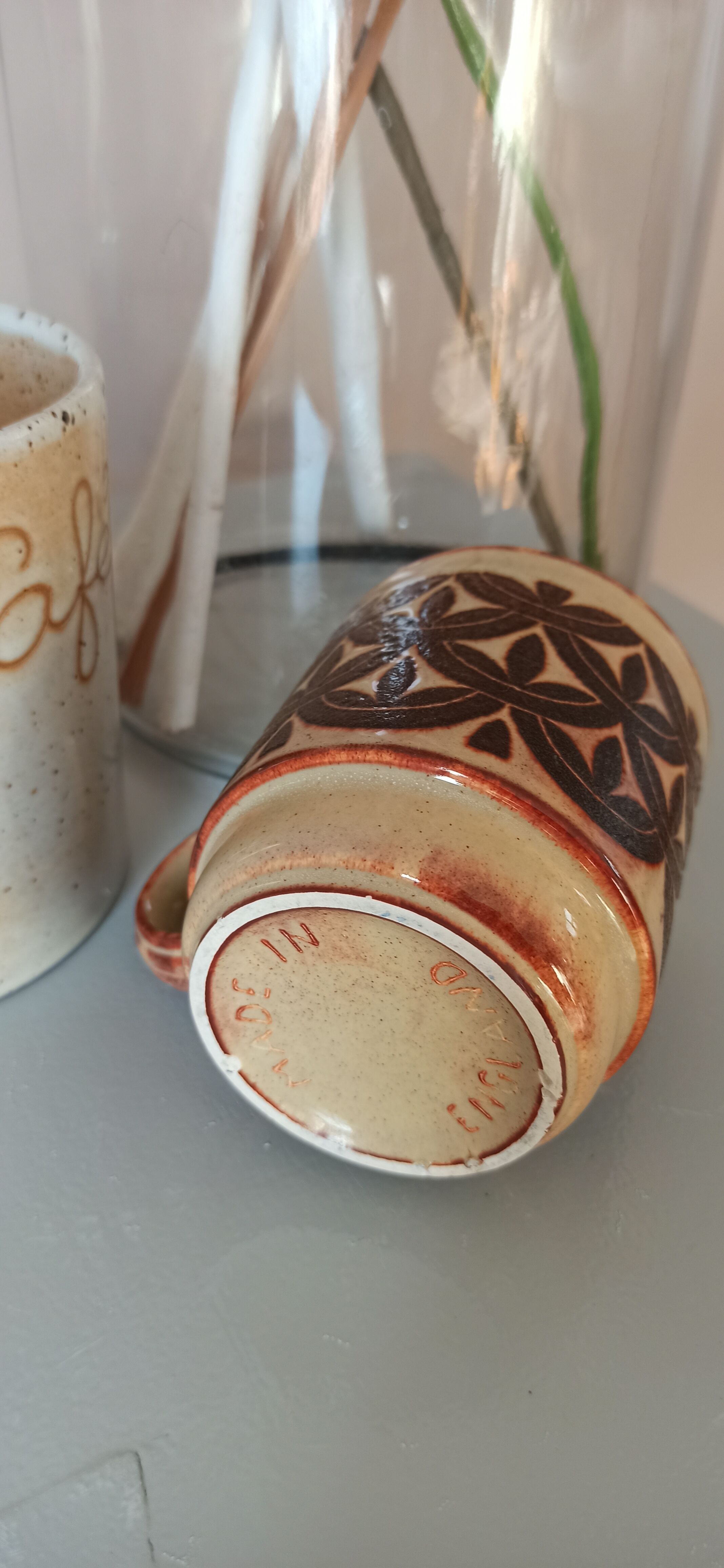 Coffee pot and mug cup in sandstone