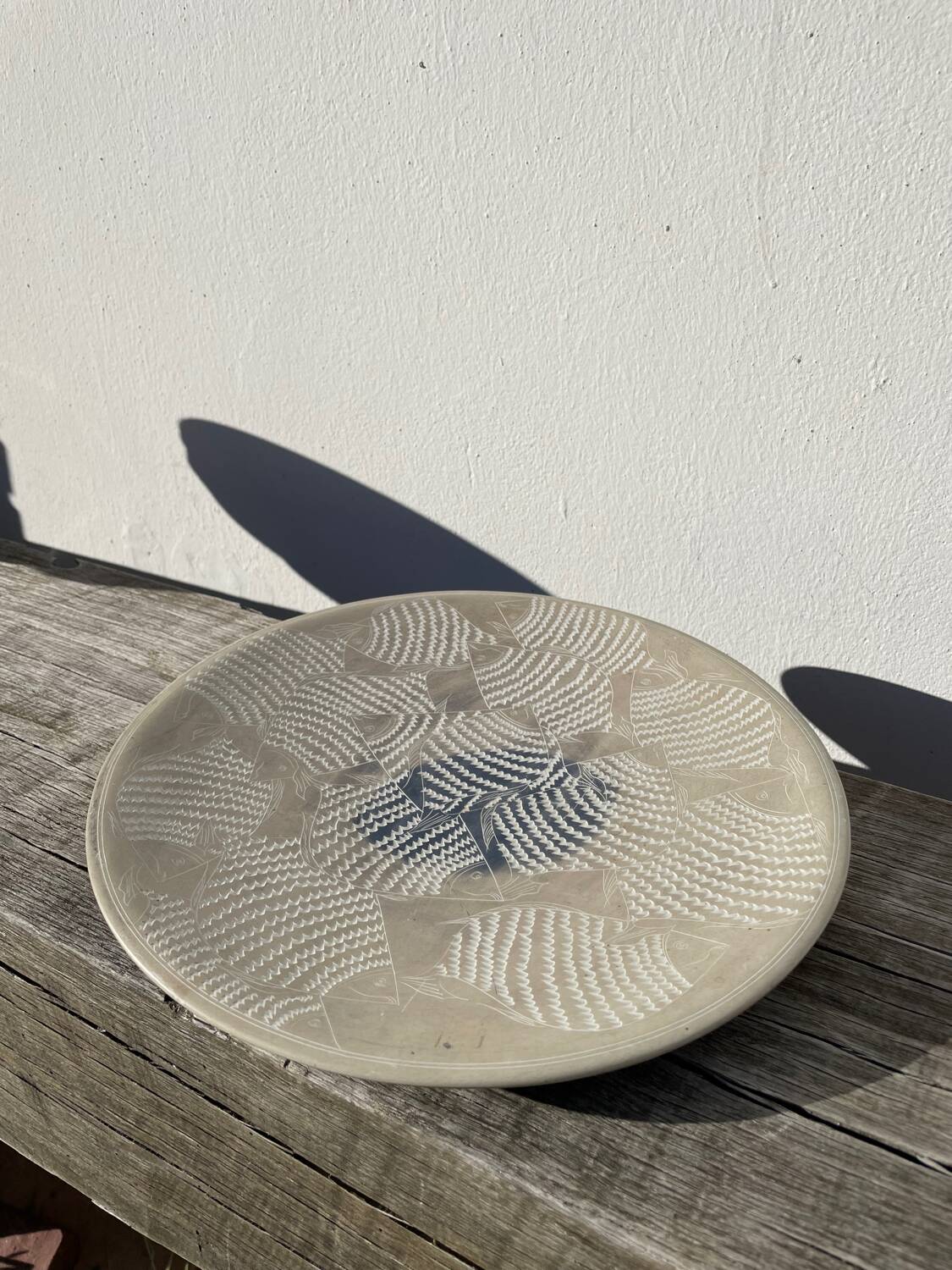 Ethnic handmade round fish dish