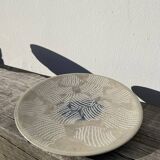 Round ethnic handmade fish dish