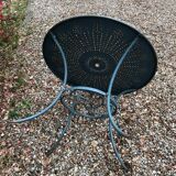 Green wrought-iron garden table round