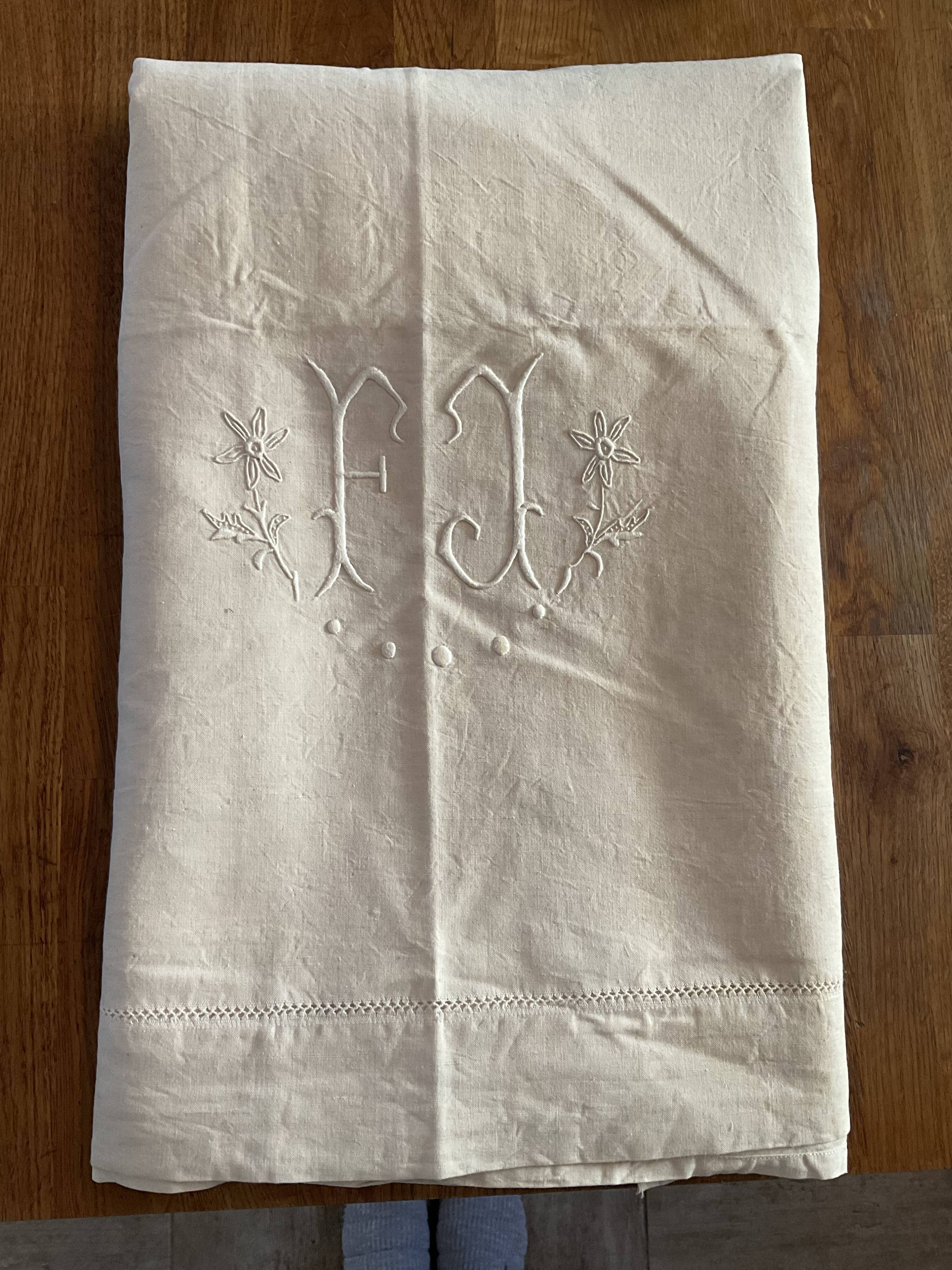 Old embroidered sheet, monogram F J