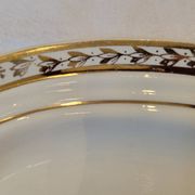 Table service in opaque porcelain with gold leaf.