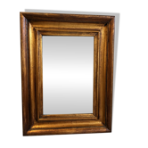 Antique mirror in gilded wood.