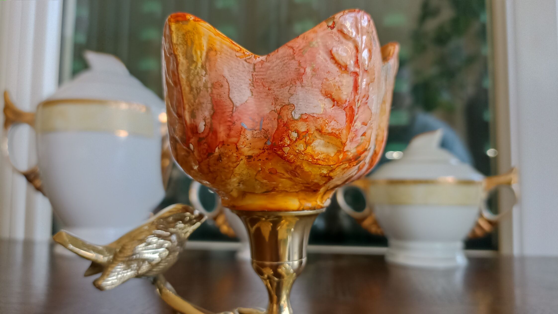 Brass cup in the shape of a bird and flowers