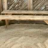 Pair of old farmhouse benches made of raw solid wood.
