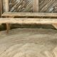 Pair of old farmhouse benches made of raw solid wood.