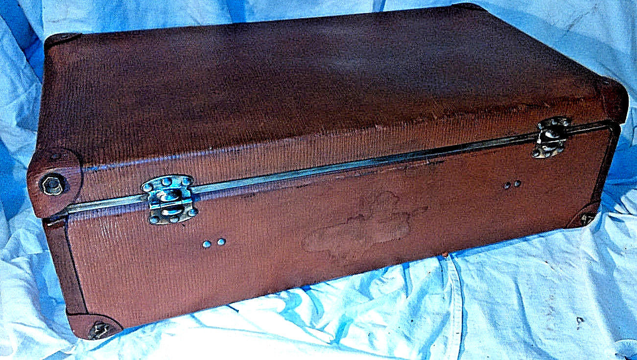 Old vintage black and white cardboard storage suitcase travel