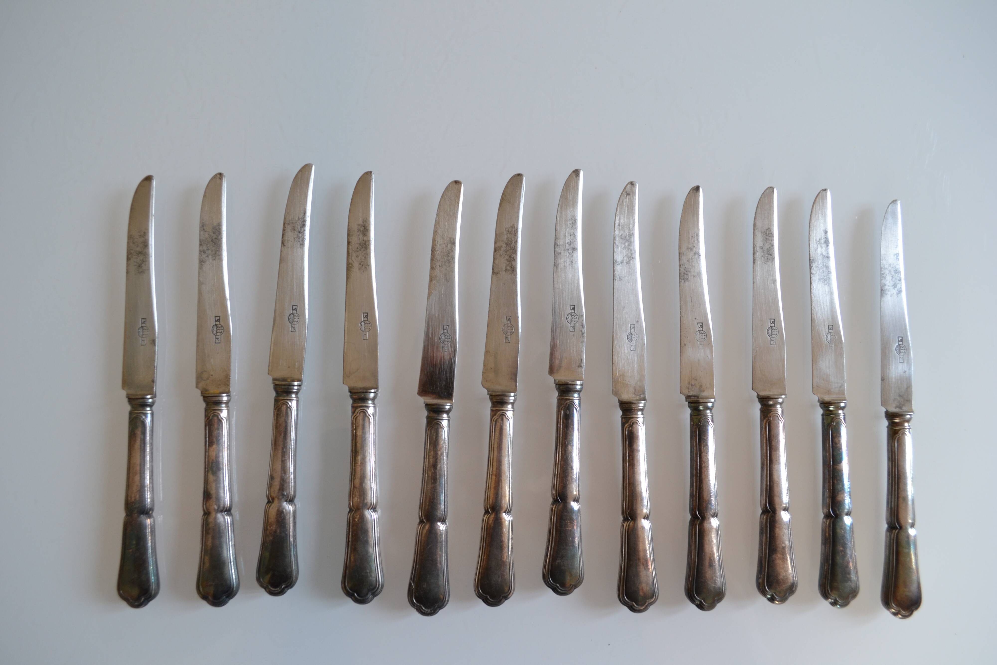 12 silver metal dessert or cheese knives