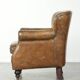 Robust cowhide armchair in a beautifully subtle size with a wonderful patina.