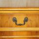 Vintage buffet made of mottled yew wood with three doors and four drawers.