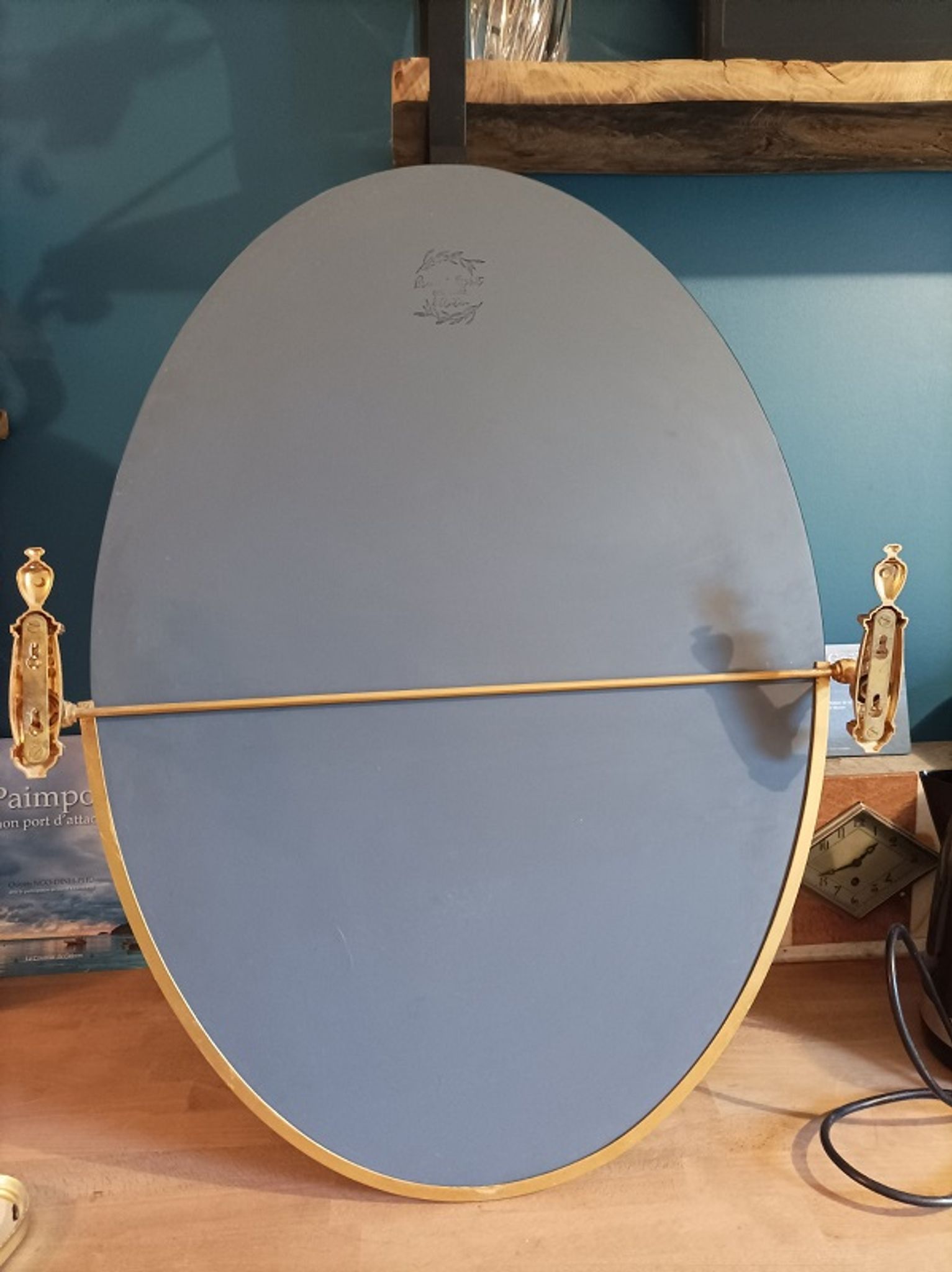 Oval mirror patinated brass frame art deco