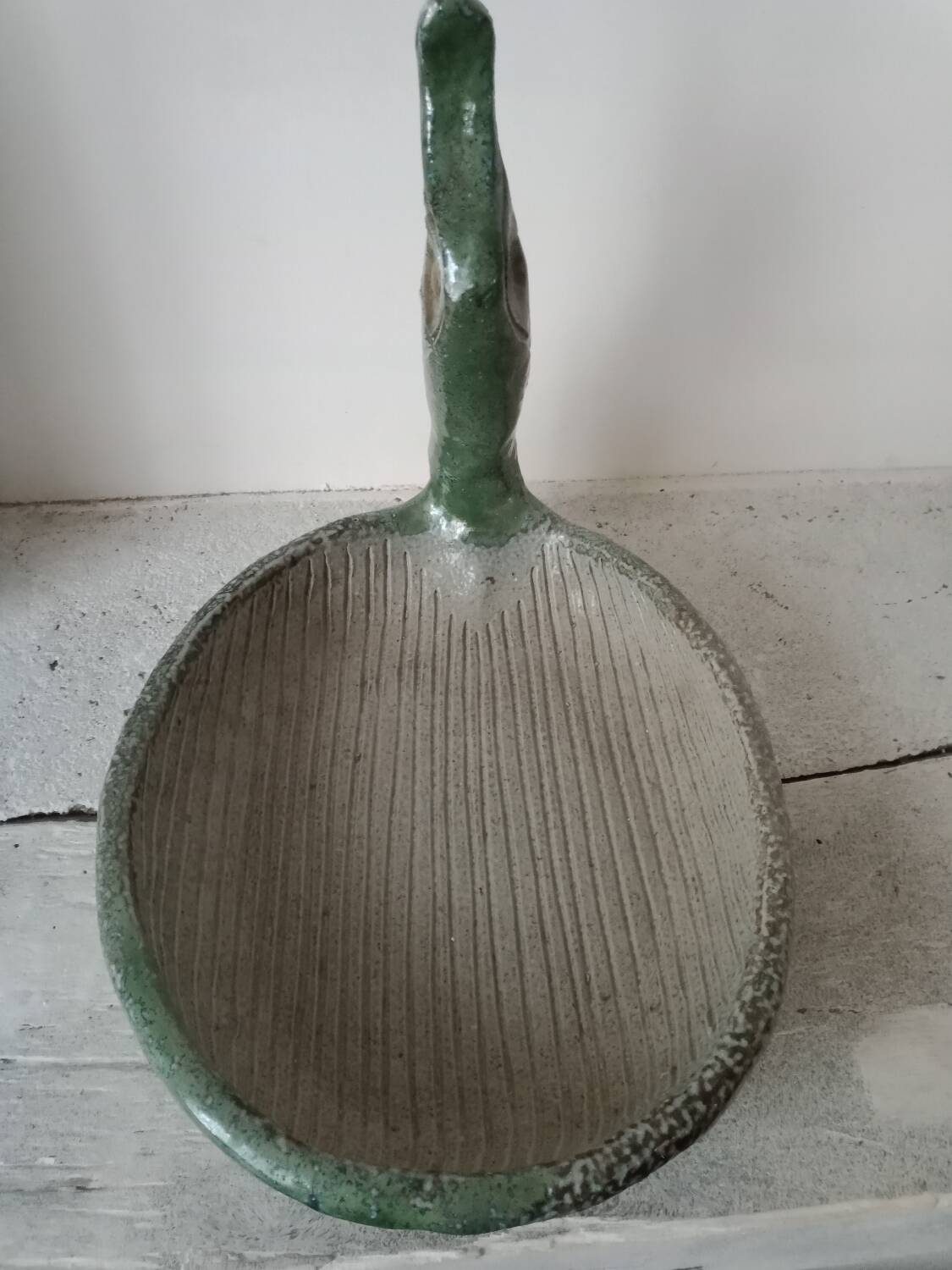 Empty pocket cup forming a bird