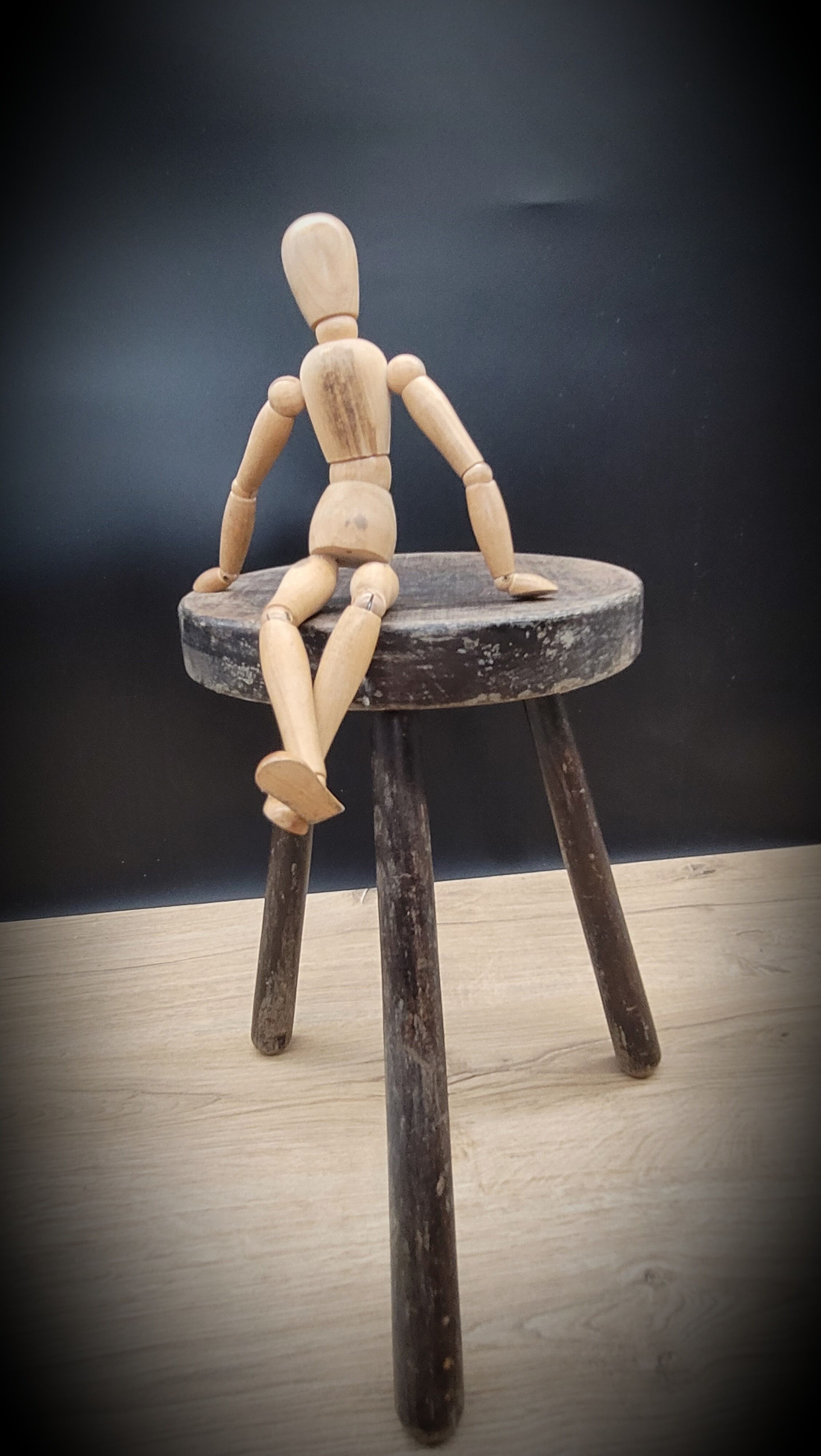 Massive black tripod stool