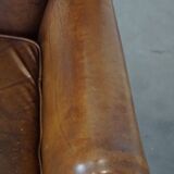 Charming sheep leather wingback armchair with a beautiful patina and excellent seating comfort