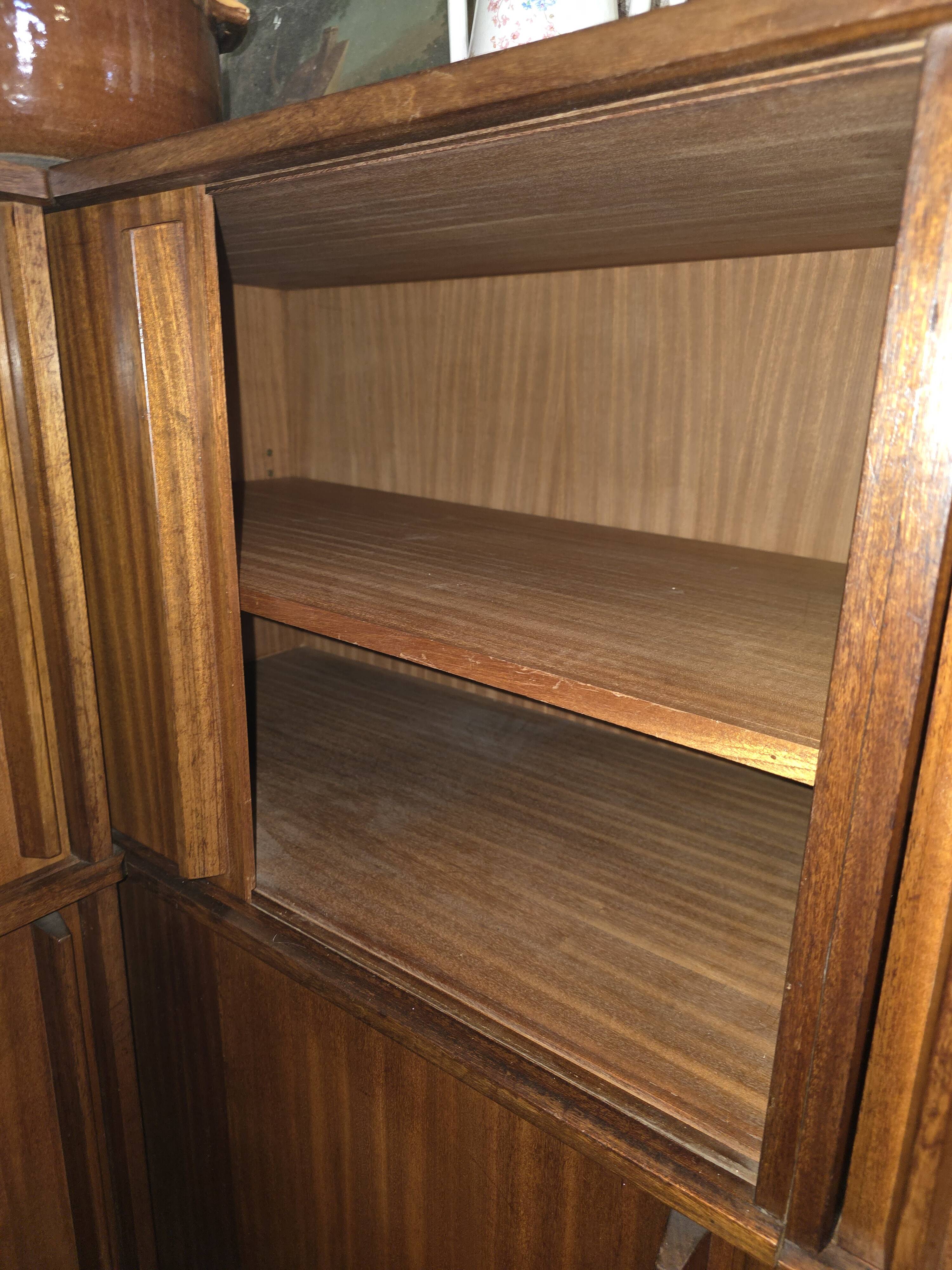 Modular corner library Oscar from the 1960s with sliding doors.