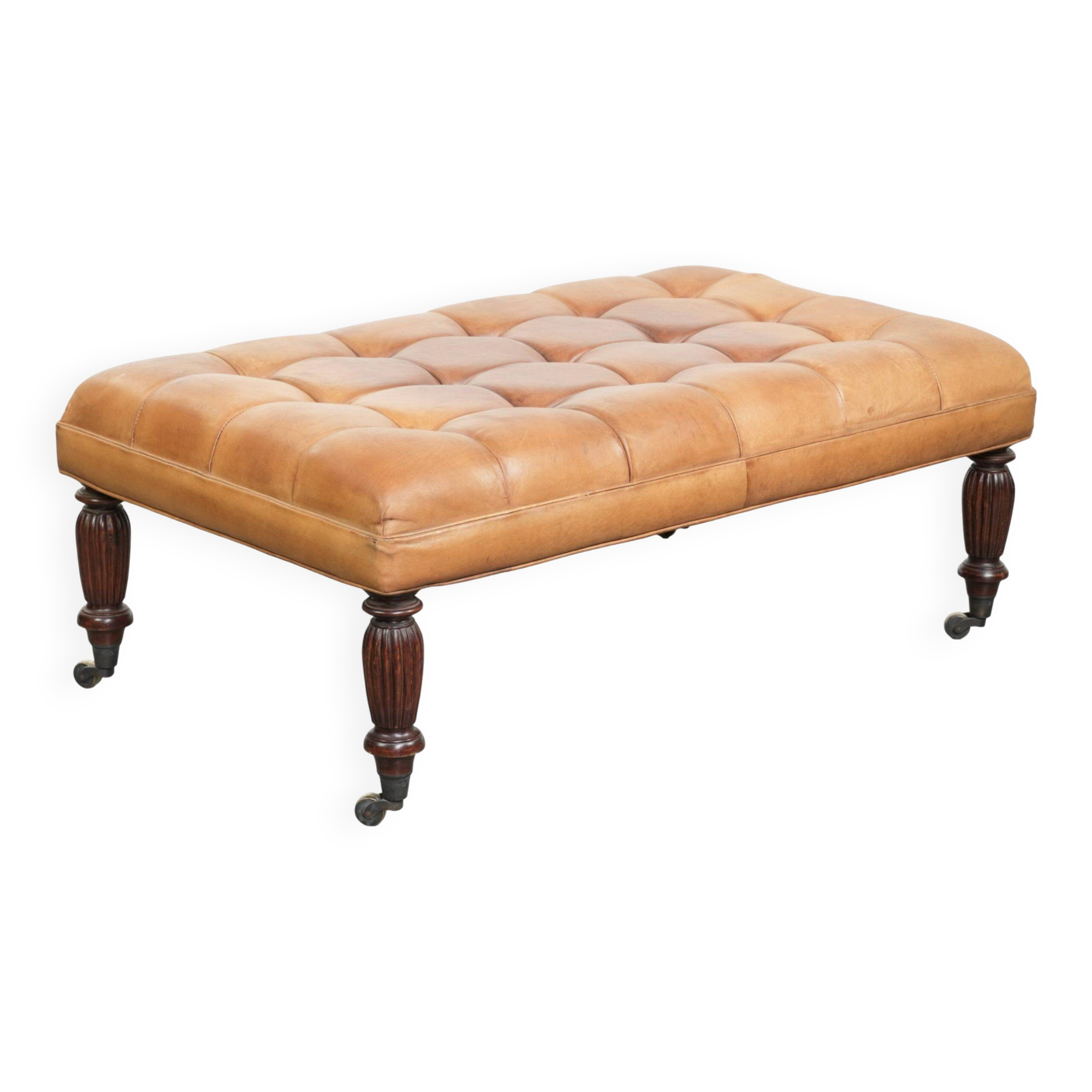 Sheepskin ottoman/coffee table on wheels in English chesterfield style