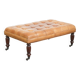 Sheepskin ottoman/coffee table on wheels in English chesterfield style