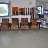 Pair of Art Deco armchairs in curved wood and multicoloured fabric from the 1920s.