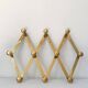 Brass accordion coat rack