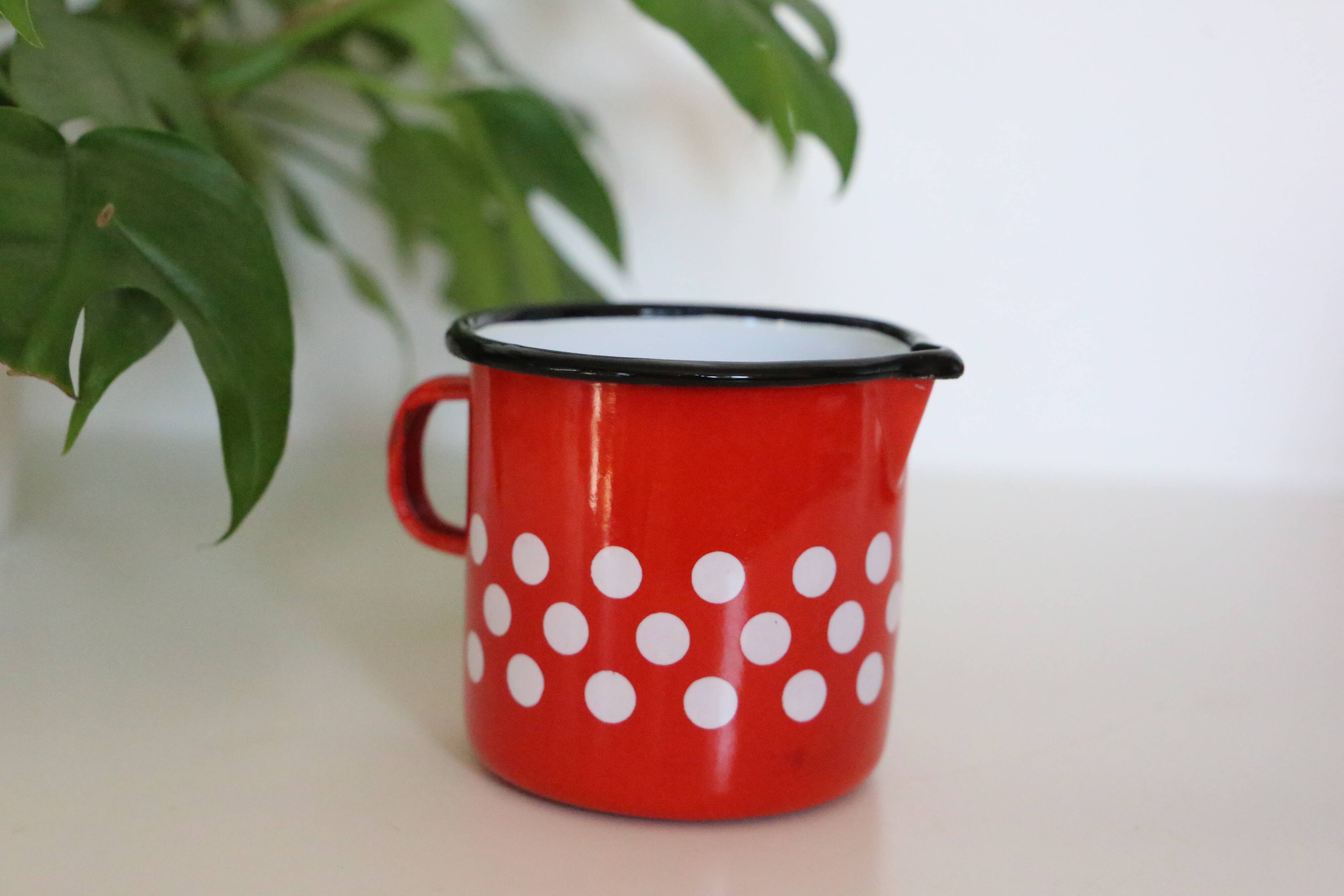 Red enamelled metal milk pot