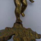 Cherub or putti carrying a globe