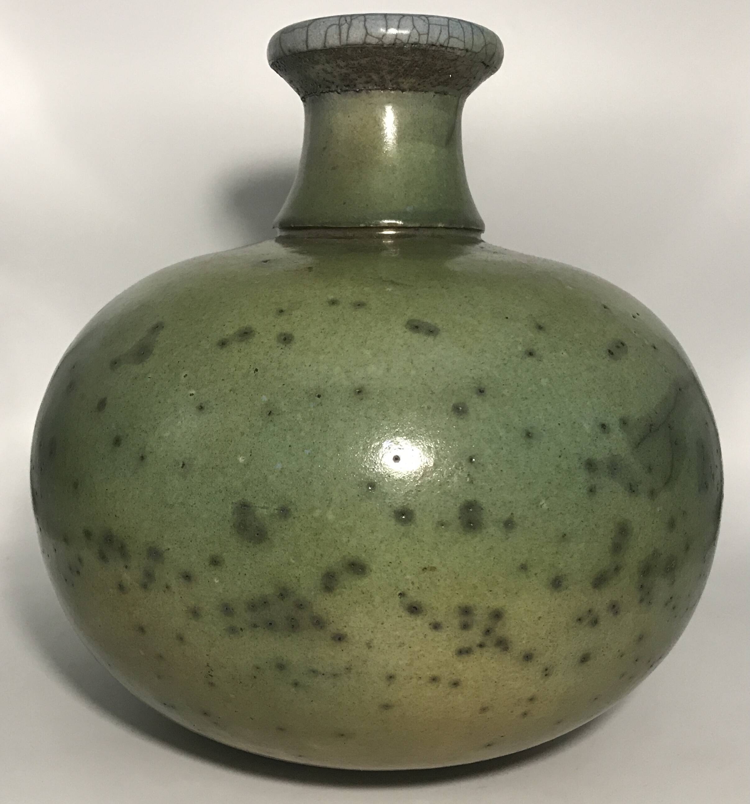 Contemporary vase ball shape raku shades of green and yellow