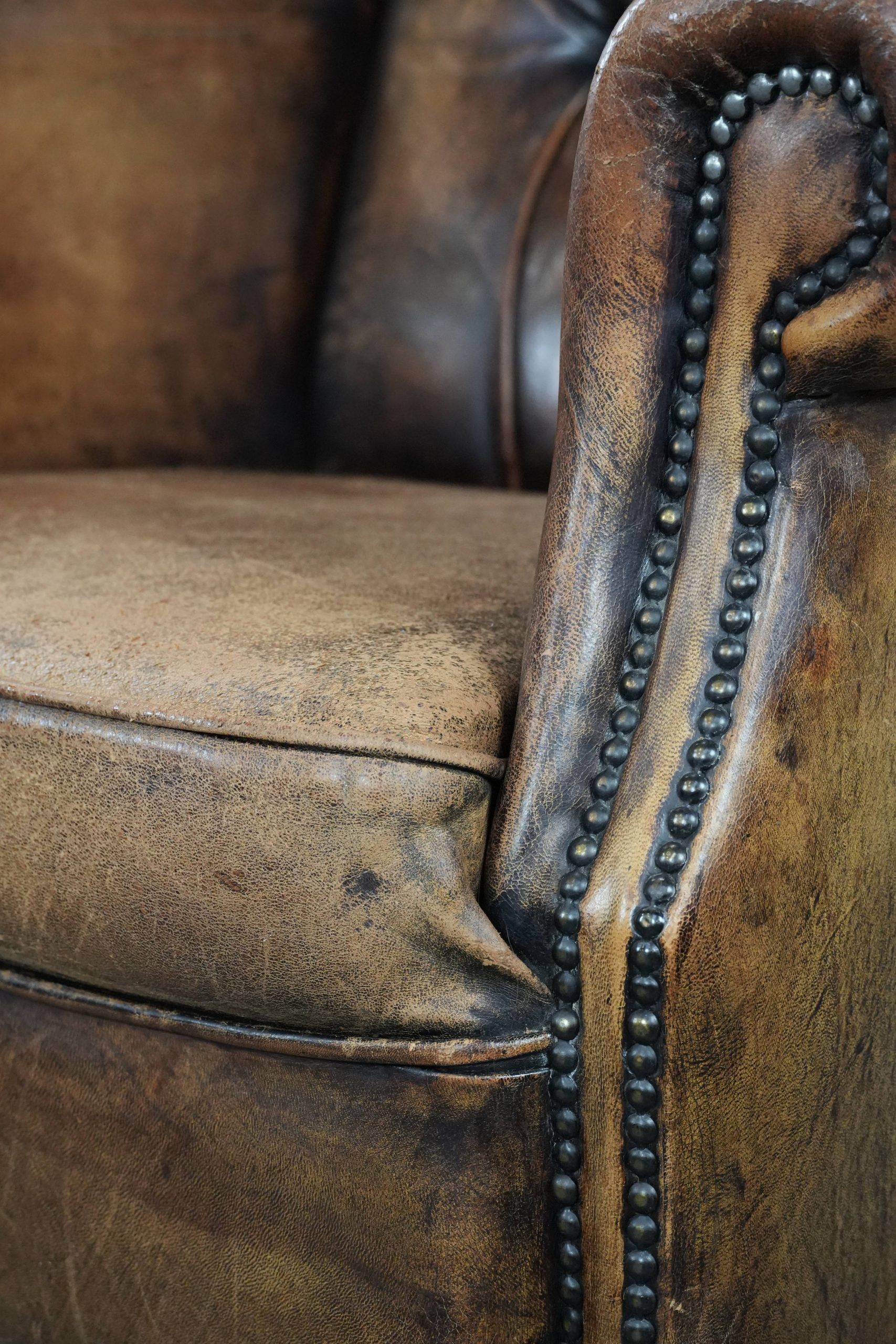 Unique large sheepskin Chesterfield wingback armchair in English style