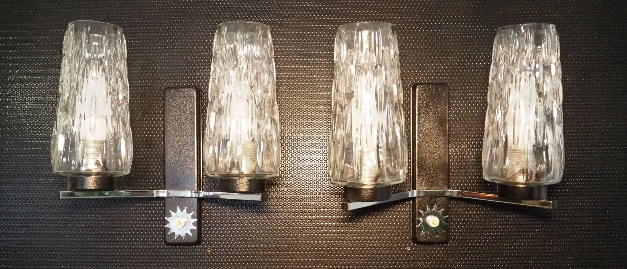 Pair of wall lights from the 1950s-1960s with a push button switch.