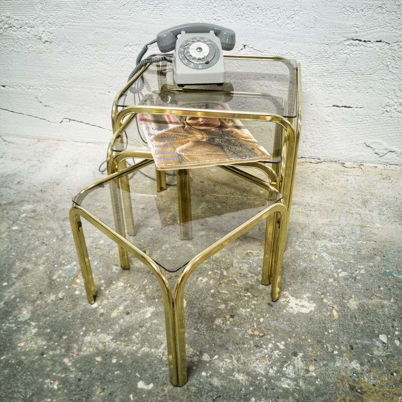 Trio of gilded metal trundle tables