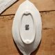 Antique leaf-shaped white English slipware dish.