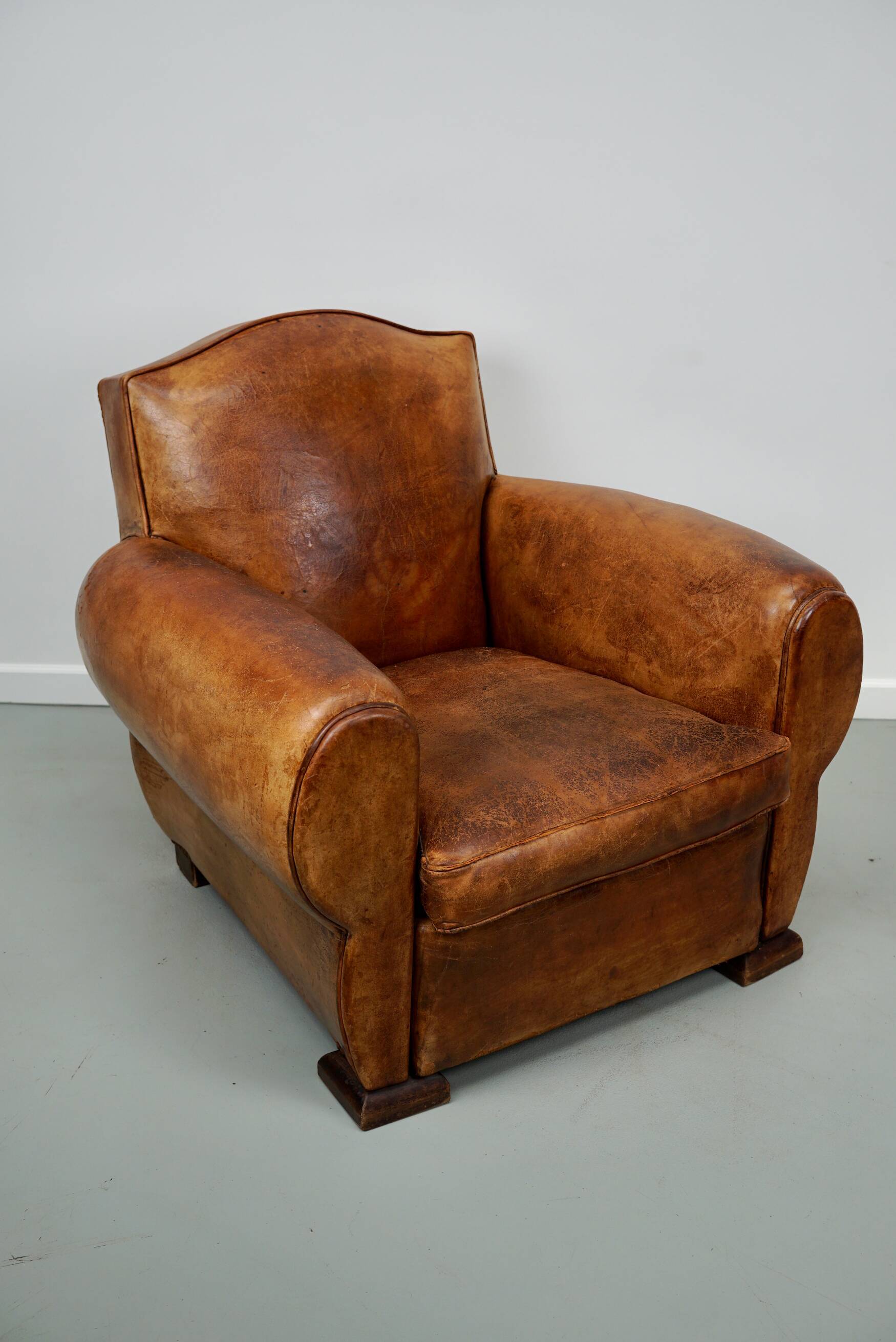 French moustache back cognac-colored leather club chair, 1940s
