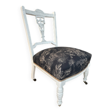 Low wheeled armchair in Napoleon III style