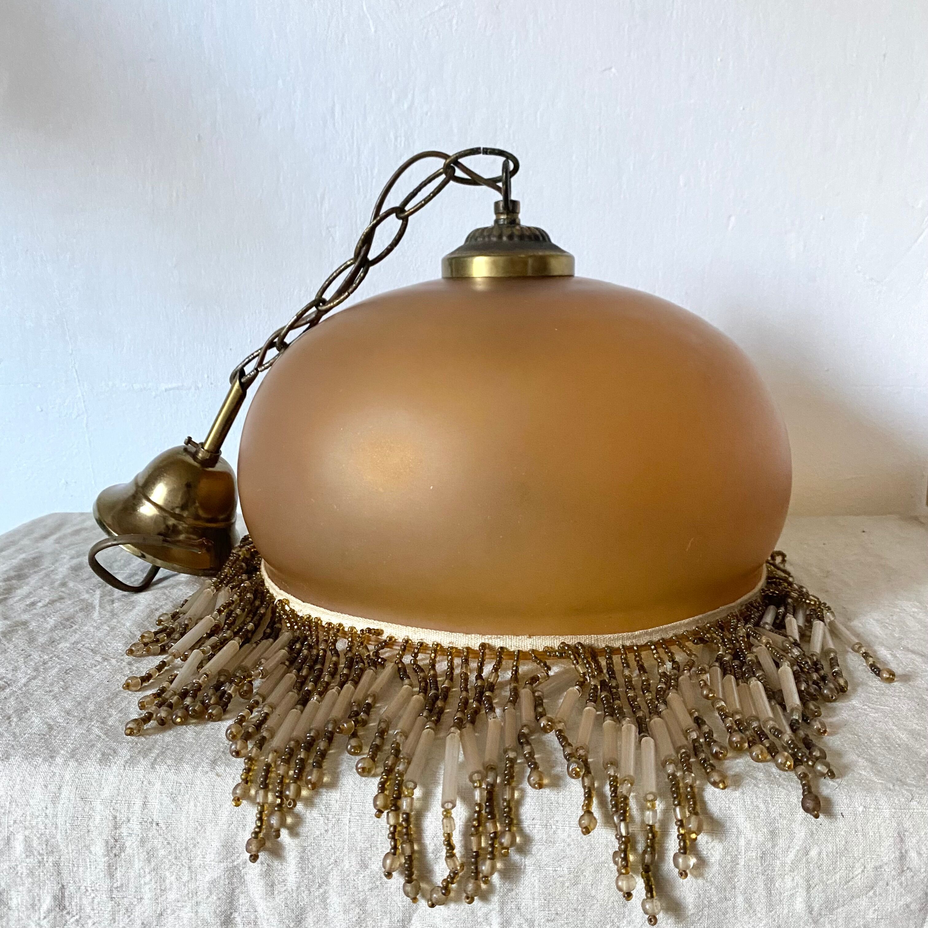 Amber polished glass and pearl suspension