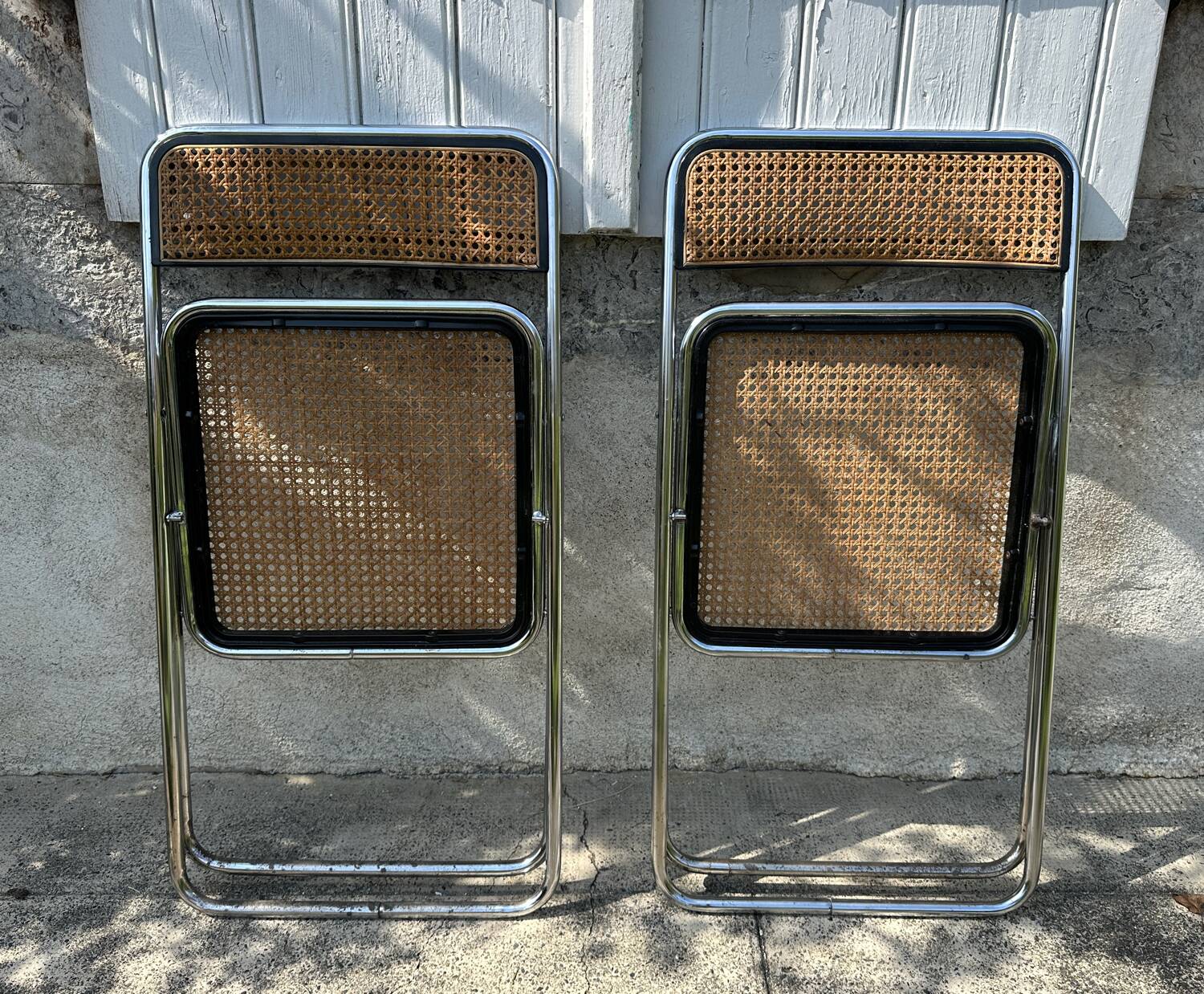 Pair of vintage metal caned folding chairs
