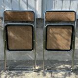 Pair of vintage metal caned folding chairs