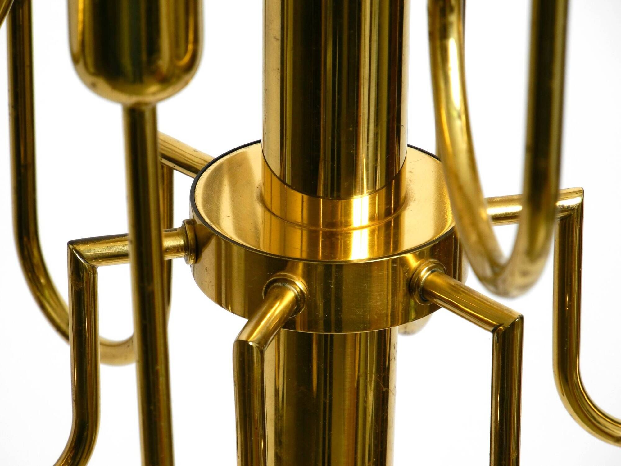 Three staged 18 arm Mid Century brass chandelier with a long brass rod