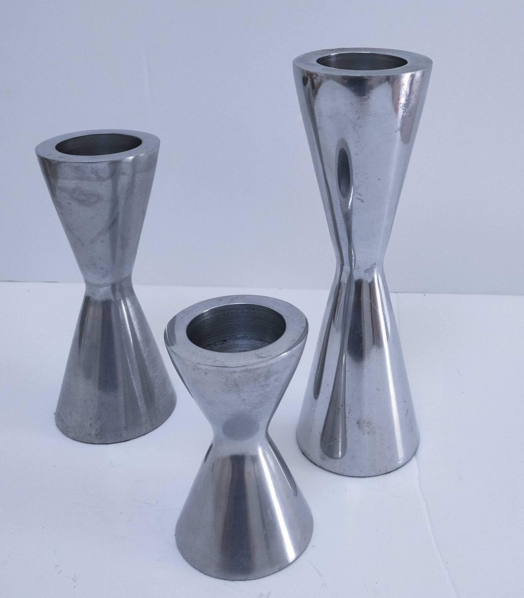 three "diabolo" aluminium design candle holders 90