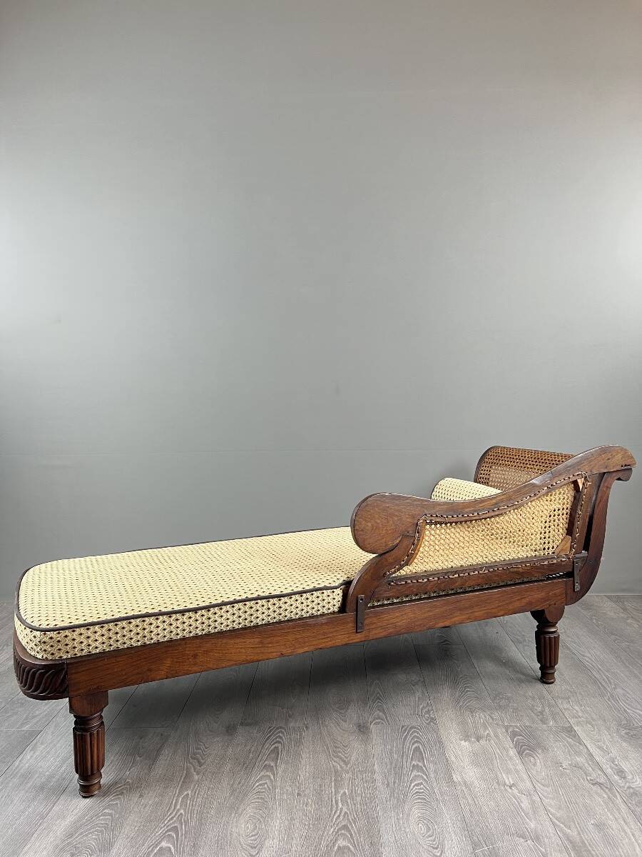 Louis XVI style meridian in carved wood and caning, 19th century.