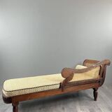 Louis XVI style meridian in carved wood and caning, 19th century.