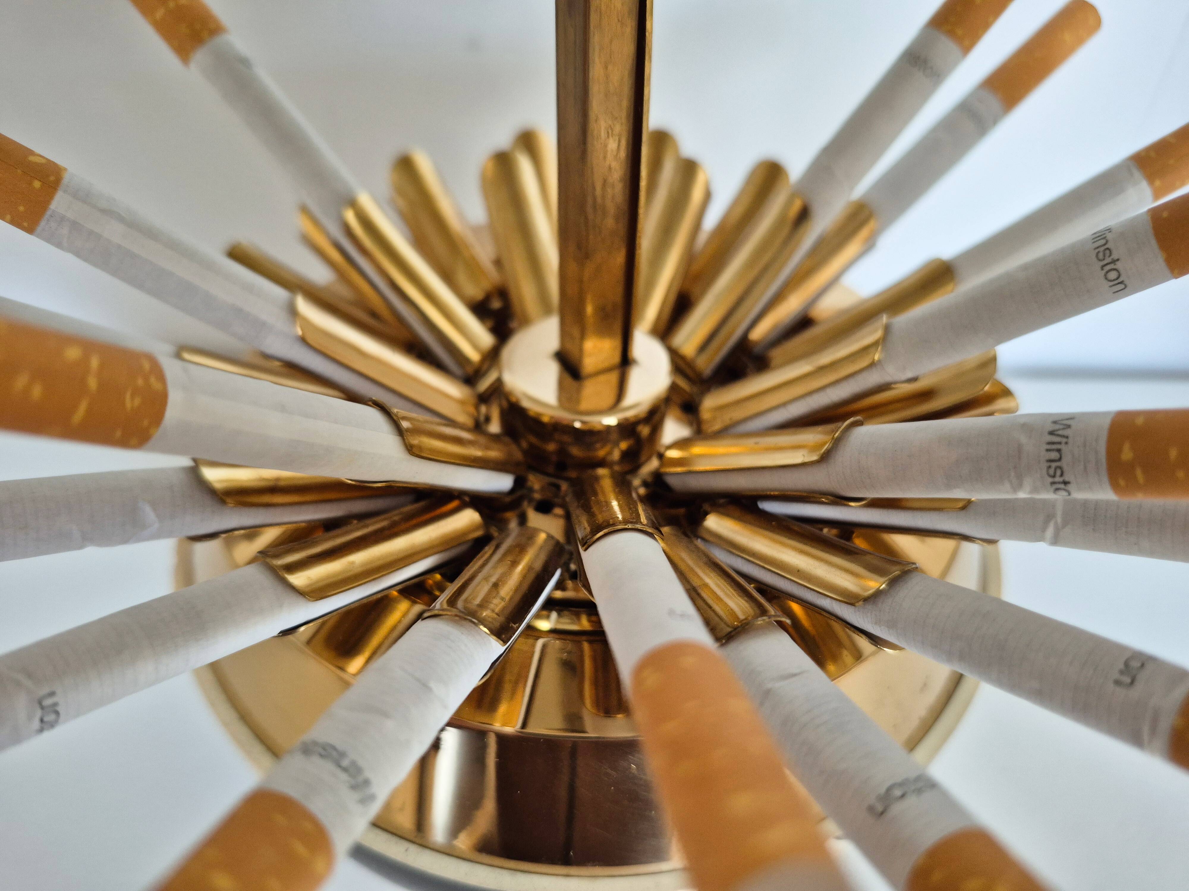 Vintage cigarette dispenser in the shape of a football.
