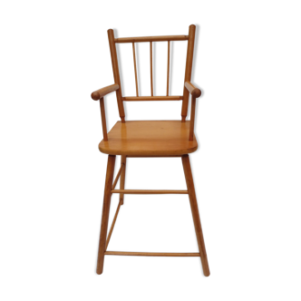 Old little high chair of light wood dolls