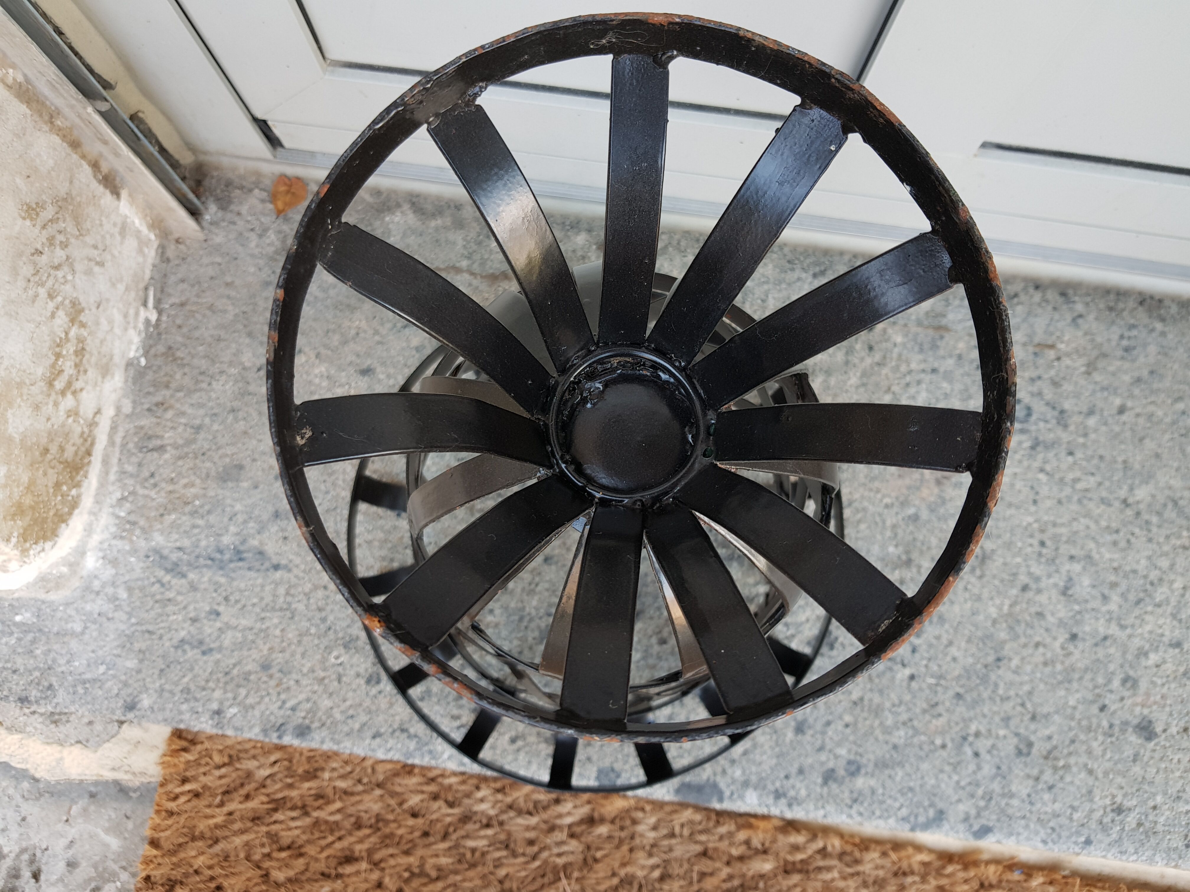 Black metal pot cover