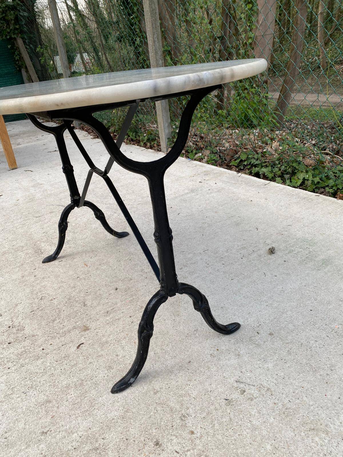 Table de bistrot marbre ovale et acier noir 4 couverts 120cm