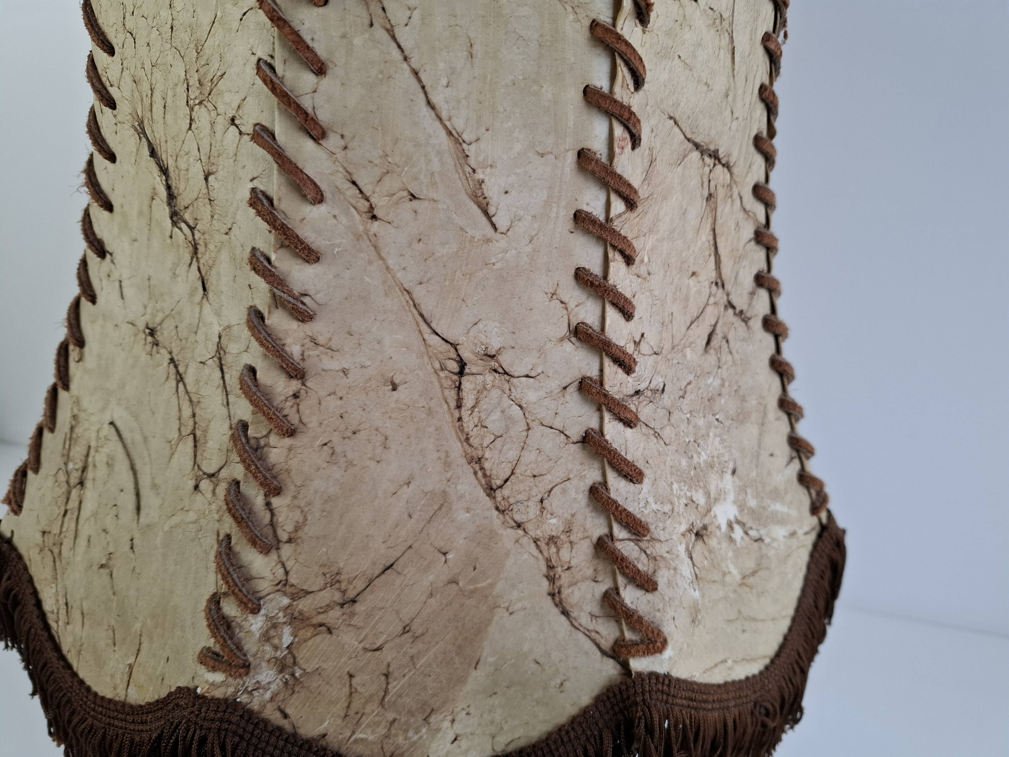 Vintage ceramic table lamp with hand-stitched leather shade, 1980s.