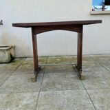 Old bistro table in wood and brass.